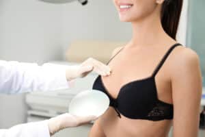 A doctor showing a woman breast implants in San Antonio