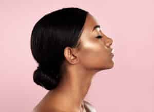 A profile shot of a woman after KYBELLA® treatments